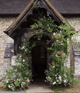 Fresh floral arch over doorway