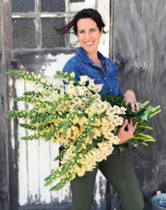 Flower farmer holding foxgloves