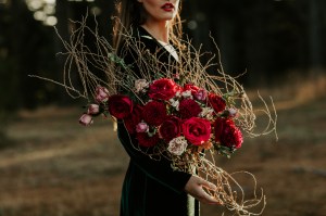Red roses and twig bridal bouquet