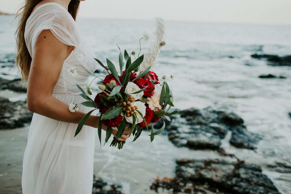 Red and white roses, native gum and grasses bouquet